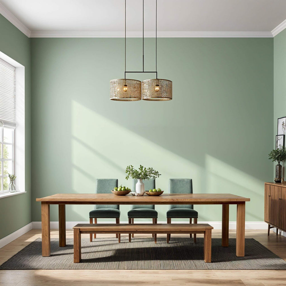 Custom handcrafted sustainable solid wood dining table with bench and cushioned chairs in a bright modern room