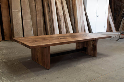Natural wood table with metal frame support