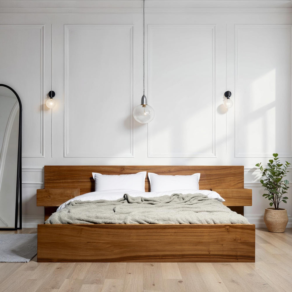 Minimalist handcrafted solid wood bed frame with integrated charging outlets in a bright, modern bedroom setting.
