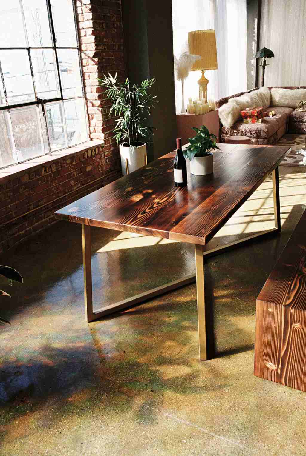 Rectangular dining table featuring a stunning natural wood top and sturdy metal legs for durability