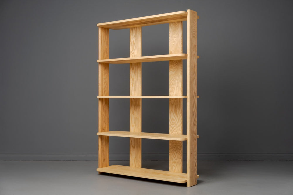 Handcrafted sustainable solid wood bookshelf with clean lines and custom woodworker design for modern storage solutions
