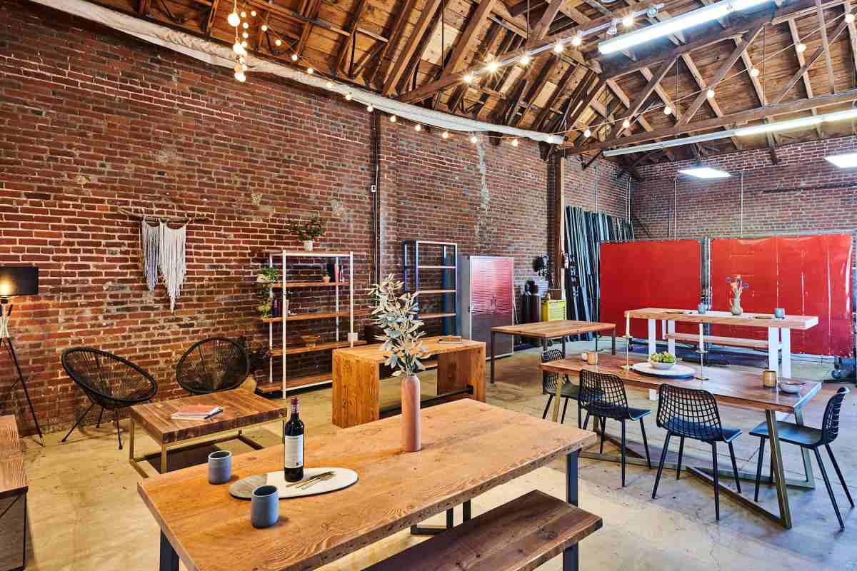 Charming restaurant interior featuring wooden tables, shelves, and other furniture pieces