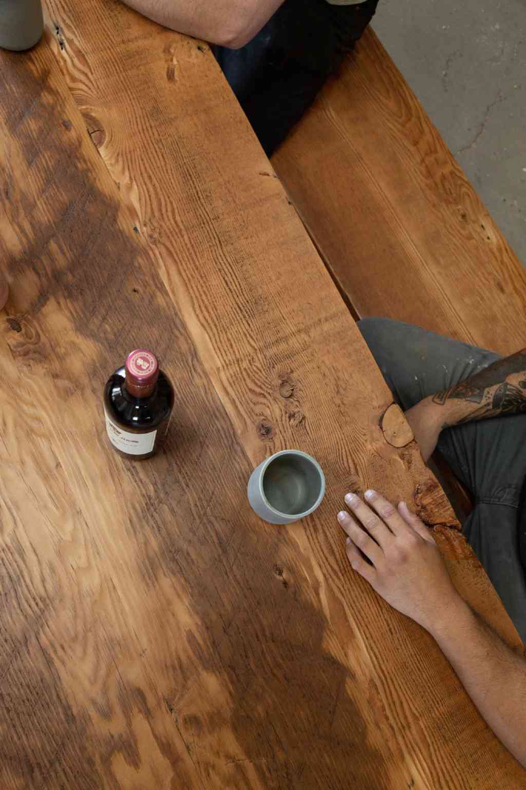 Rectangular wooden table with wooden chair attached
