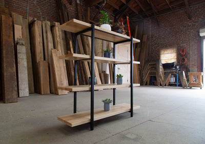 Tall wooden bookcase with sturdy black metal supports