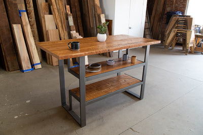 Wooden table with metal base and two bottom racks