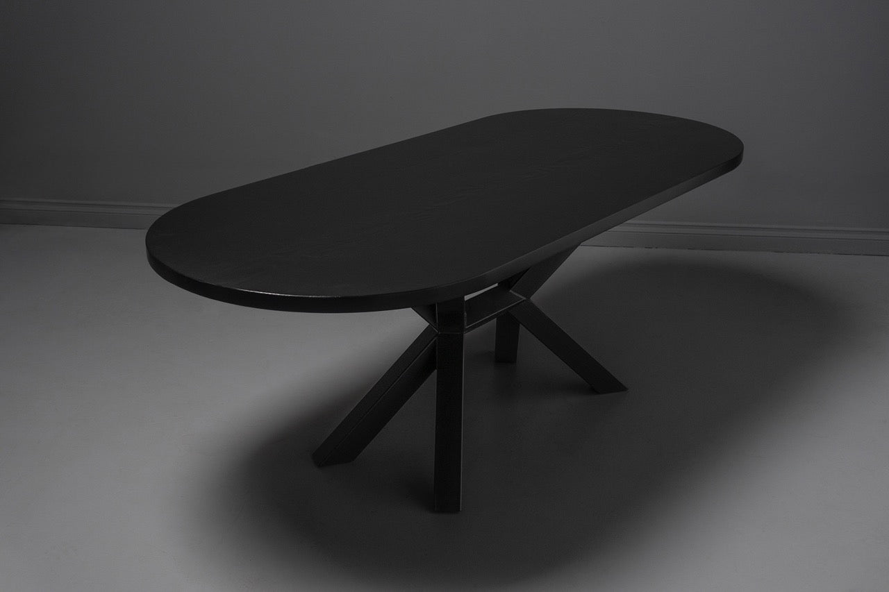 Polished black wooden end table with rounded edges